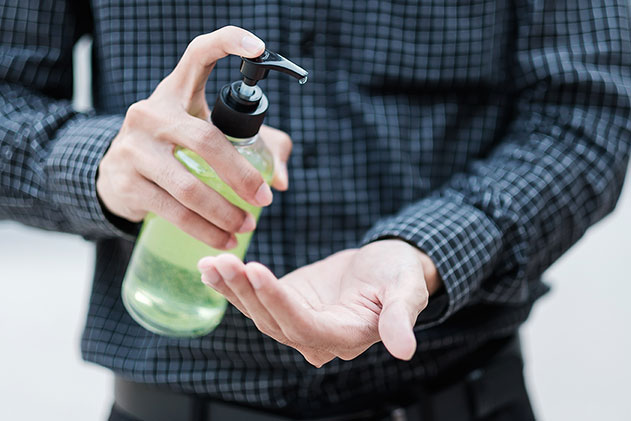 A man uses hand-sanitizer to fight against Covid-19.