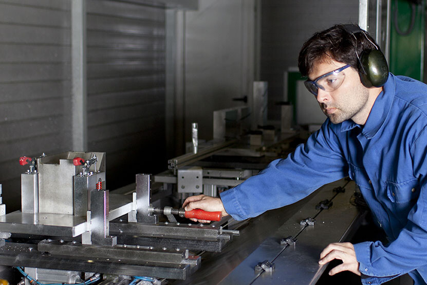 professional technician at work in machine shop